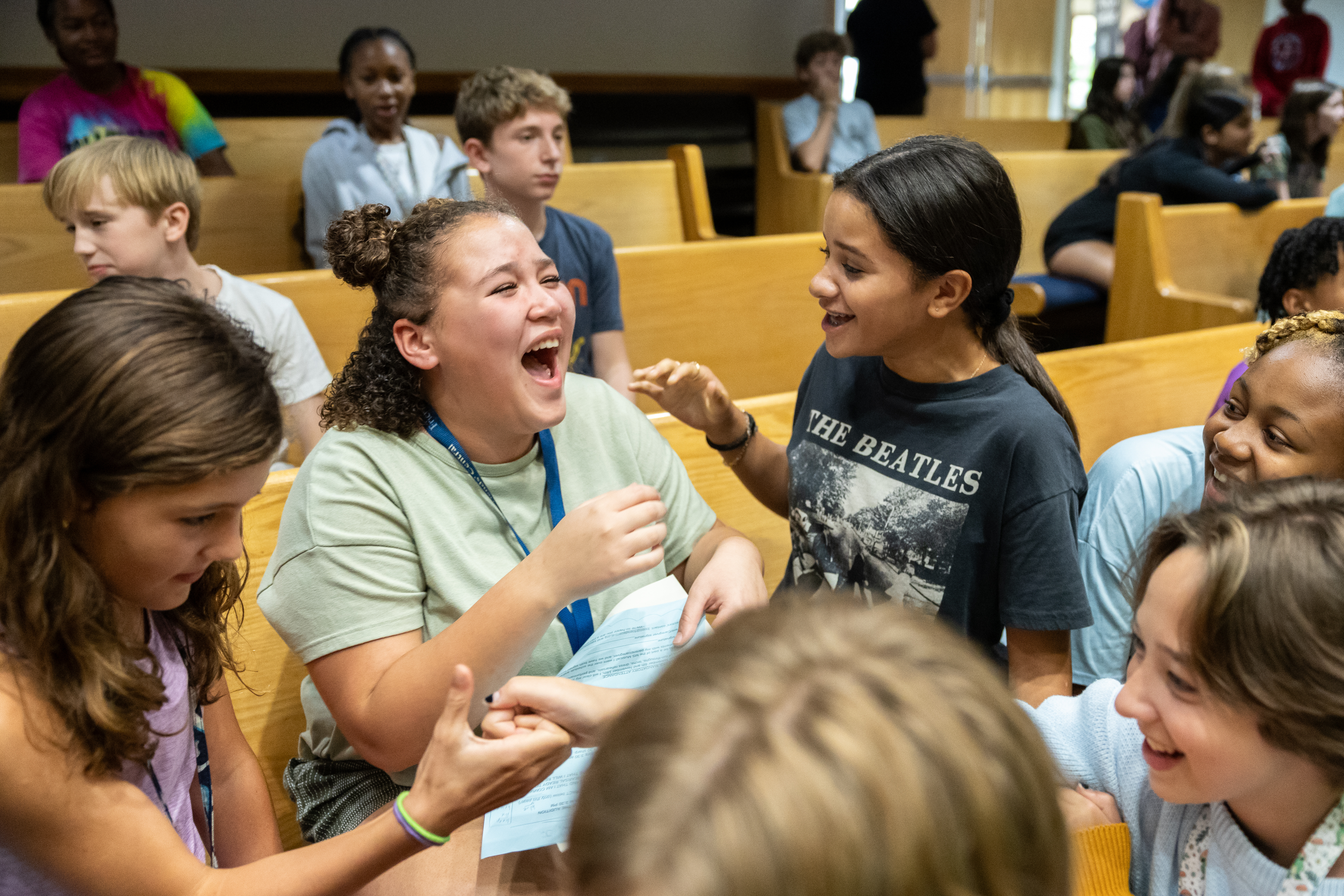 Middle School students joyfully laughing. 